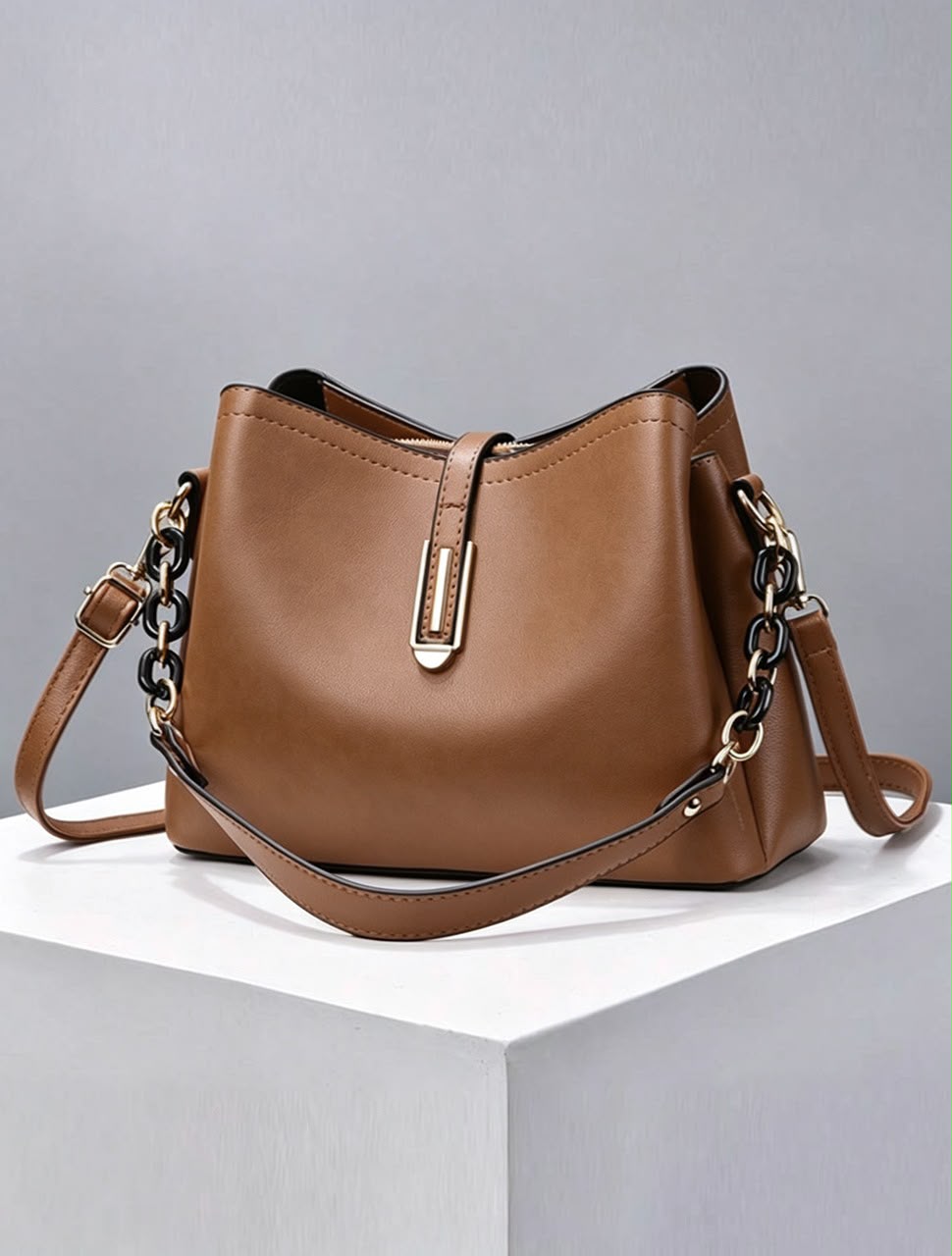 U leather bucket-style crossbody bag