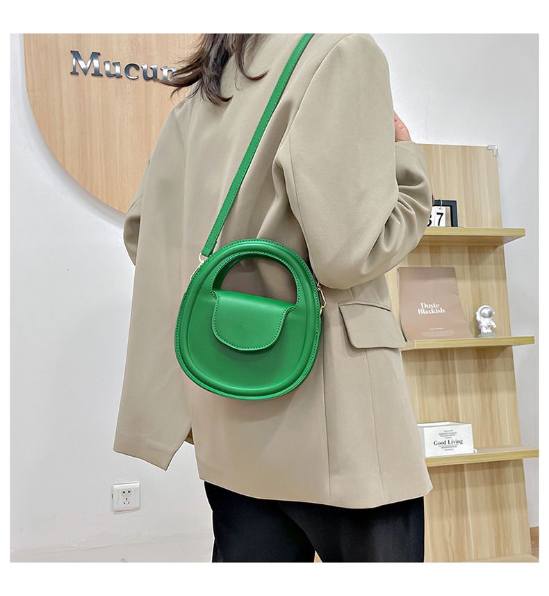Round faux-leather crossbody bag