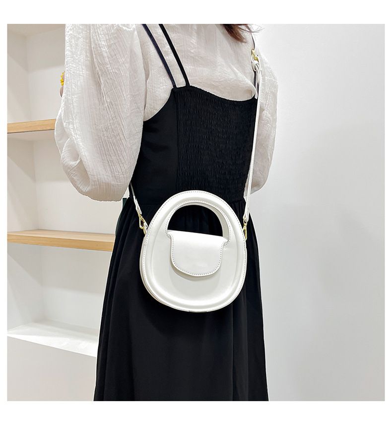 Round faux-leather crossbody bag