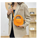 Round faux-leather crossbody bag